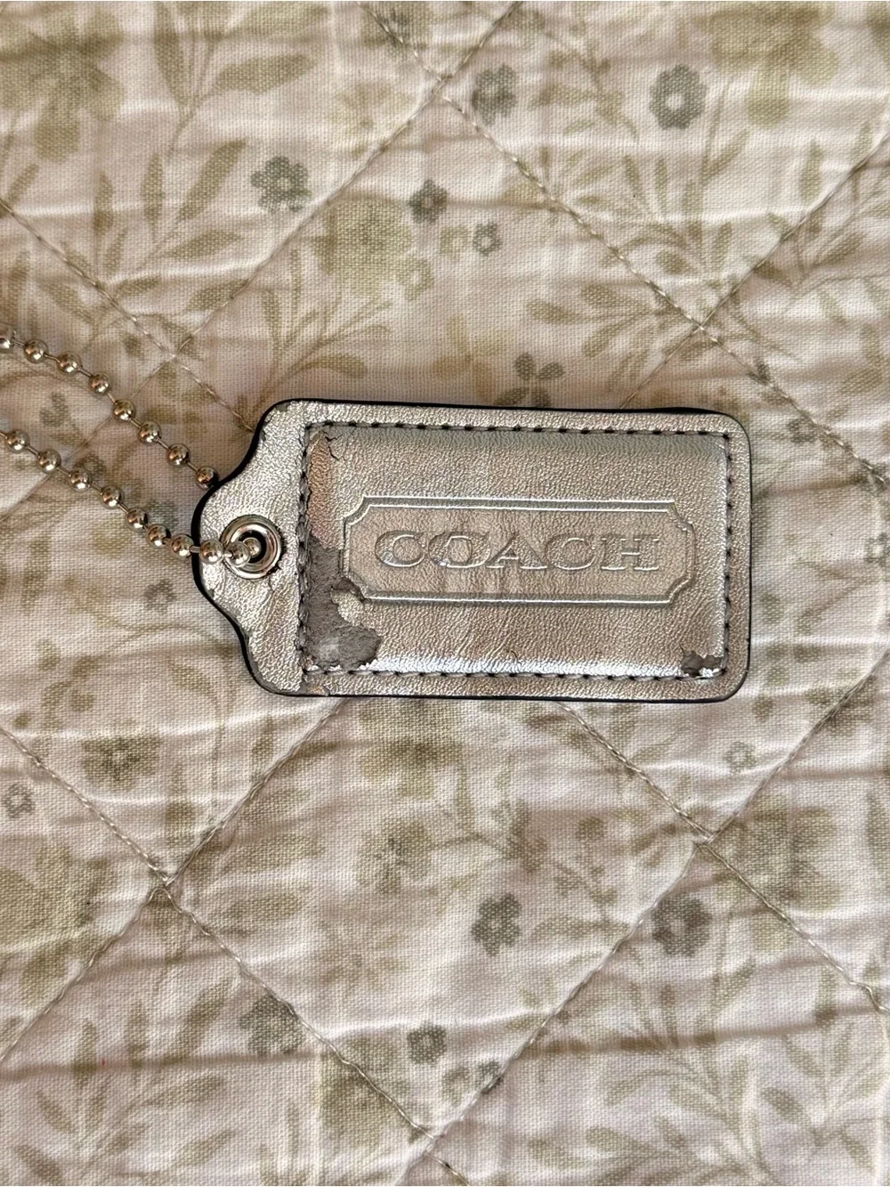 Coach silver metallic hang tag